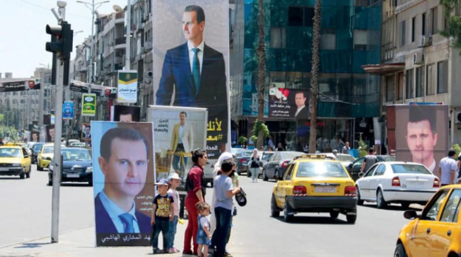  Pictures of Syrian President Bashar al-Assad on a street in Damascus on May 18, 2021 (Reuters).