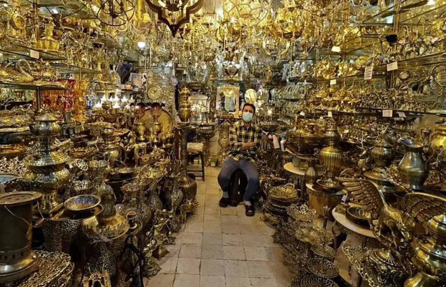 An Iranian vendor waits for customers at Tehran's Grand Bazaar - AFP

