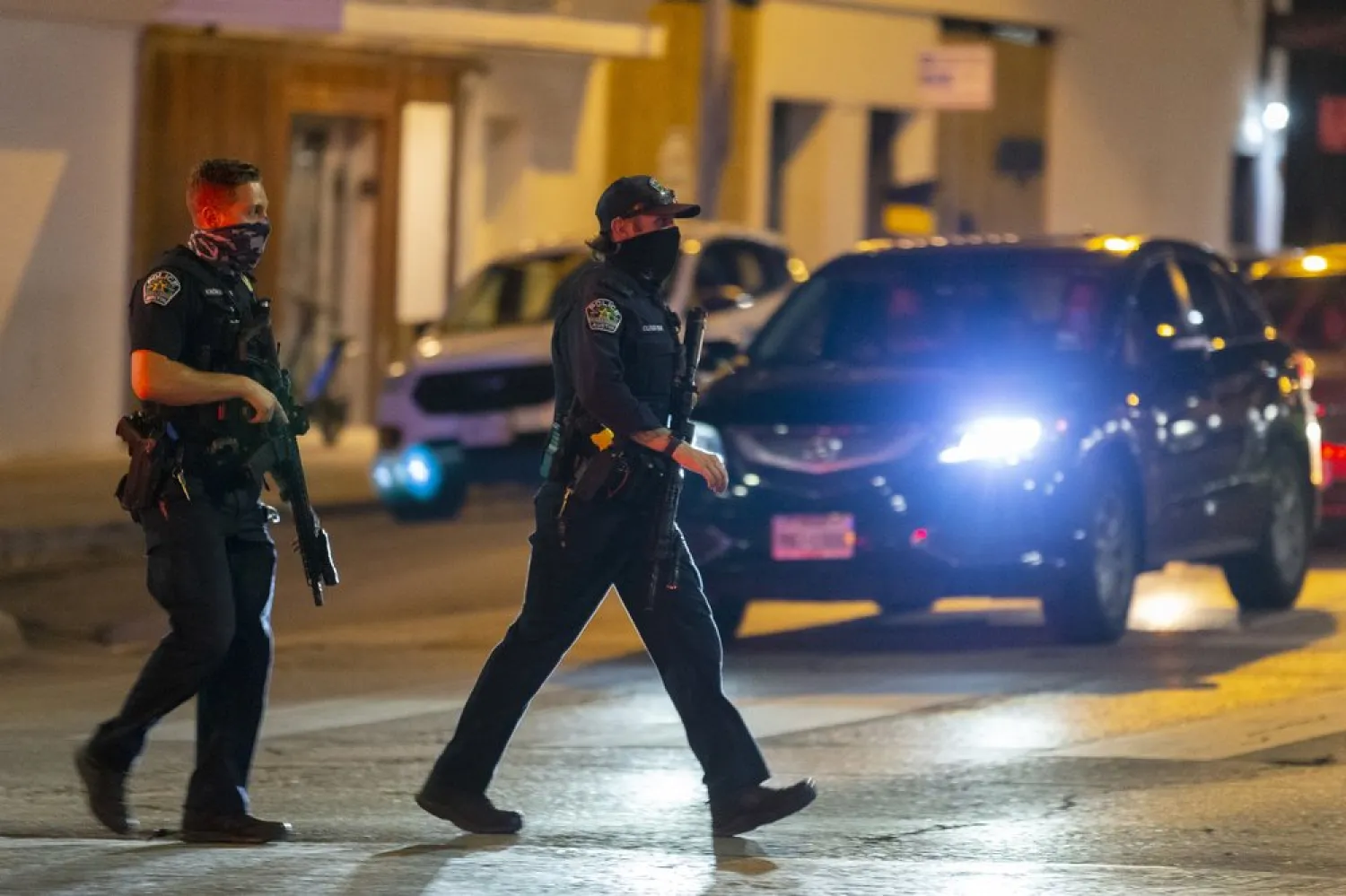 FILE: Austin police officers monitor a crosswalk of Congress Ave. during an investigation of a homicide shooting in downtown Austin, Saturday, July 25, 2020.(Stephen Spillman/Austin American-Statesman via AP)
