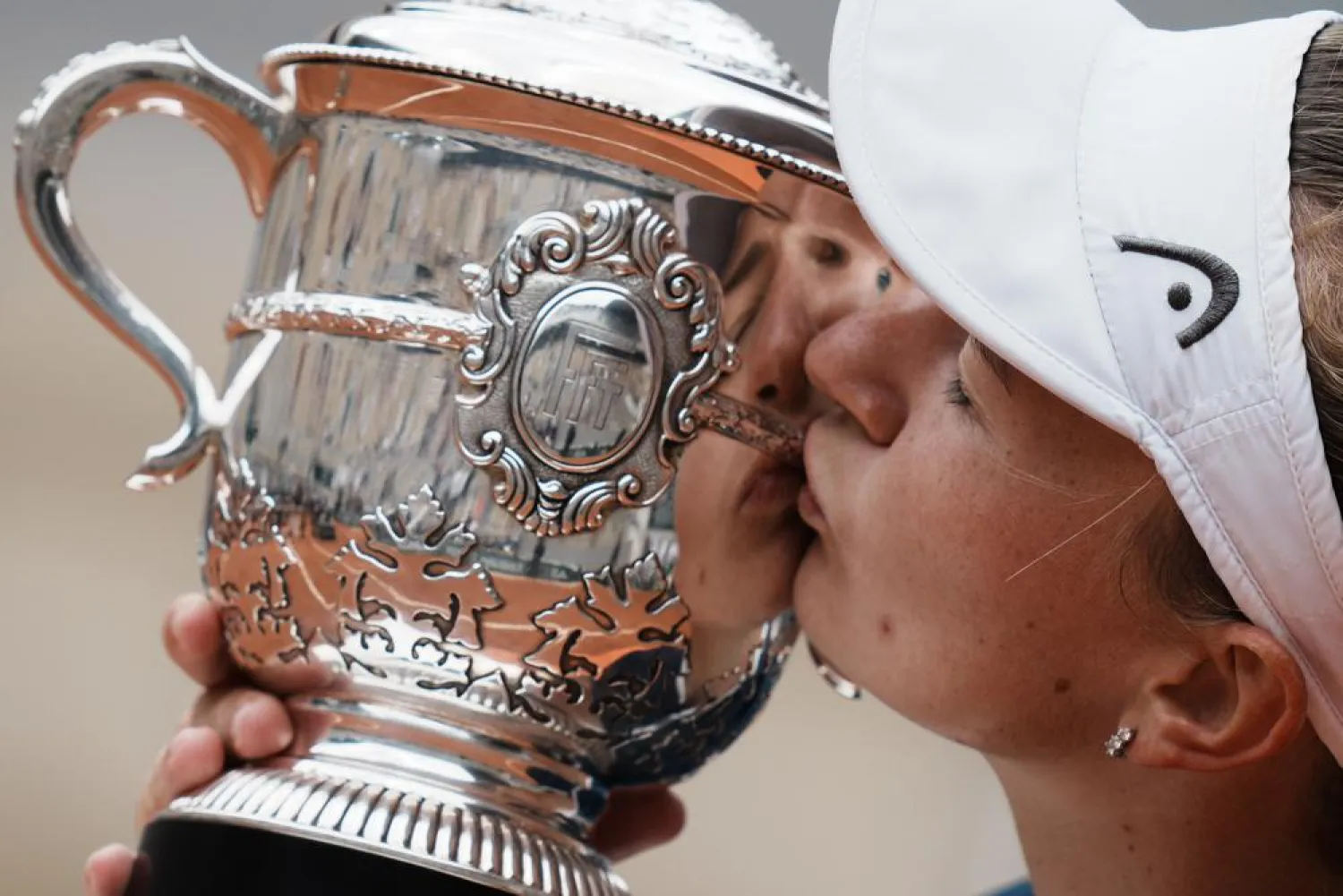 Barbora Krejcikova kisses the trophy after defeating Anastasia Pavlyuchenkova during their final match of the French Open at Roland Garros stadium Saturday, June 12, 2021 in Paris. (AP)