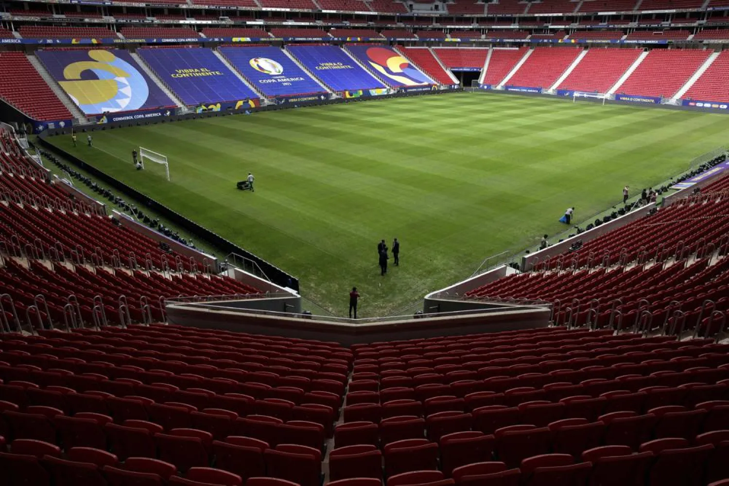 Employees prepare the National Stadium for the Copa America tournament in Brasilia, Brazil, Friday, June 11, 2021. (AP)