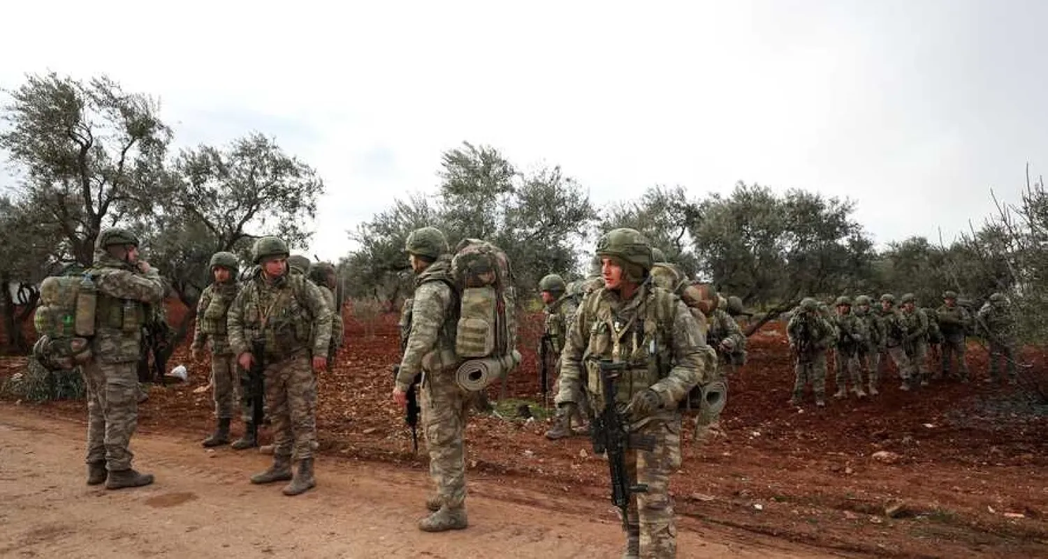 Turkish soldiers gather in the village of Qaminas, about 6 kilometers southeast of Idlib city in northwestern Syria, Feb. 10, 2020. AFP
