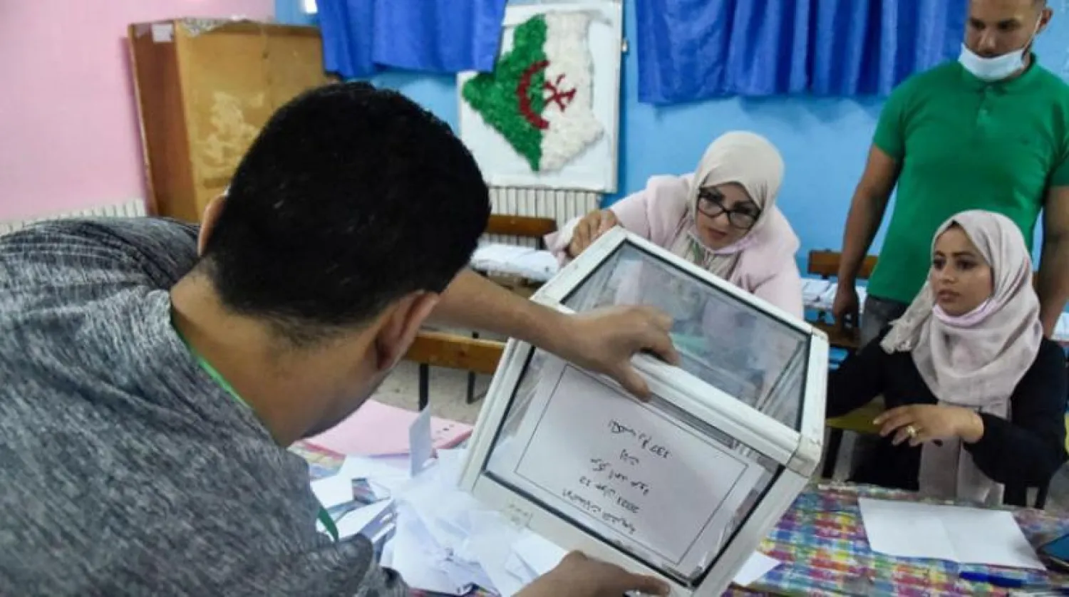 Algerian elections staff count ballots for parliamentary elections at a polling station in Bouchaoui, Algiers (AFP)