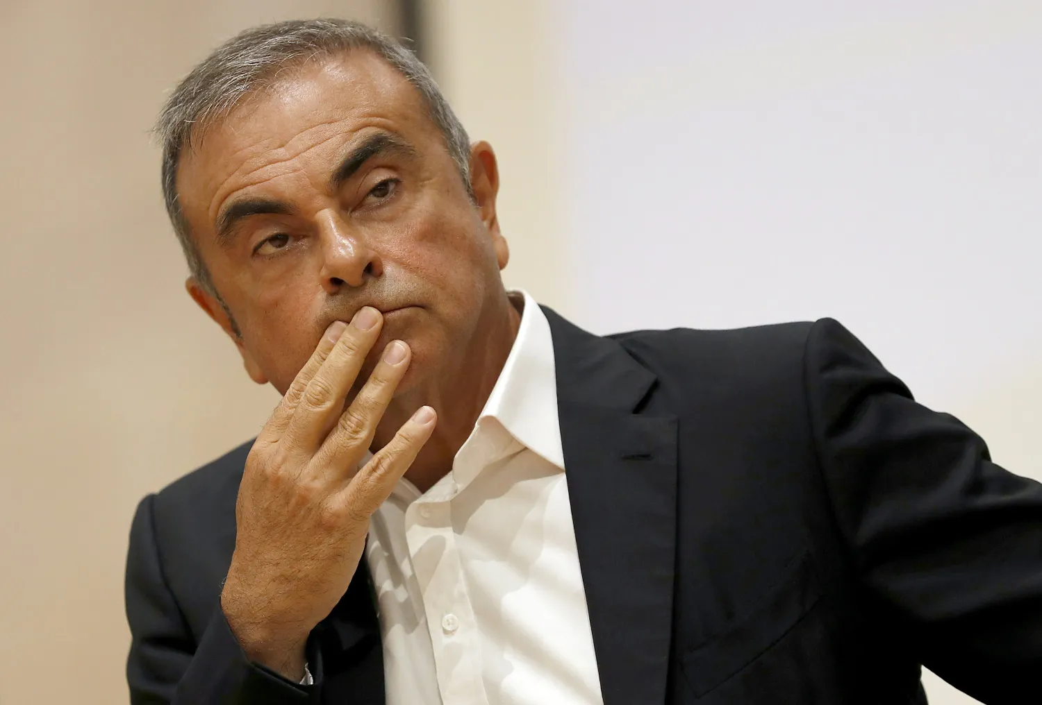 FILE - In this Sept. 29, 2020 file photo, former Nissan Motor Co. Chairman Carlos Ghosn holds a press conference at the Maronite Christian Holy Spirit University of Kaslik, north of Beirut, Lebanon. (AP Photo/Hussein Malla, file)