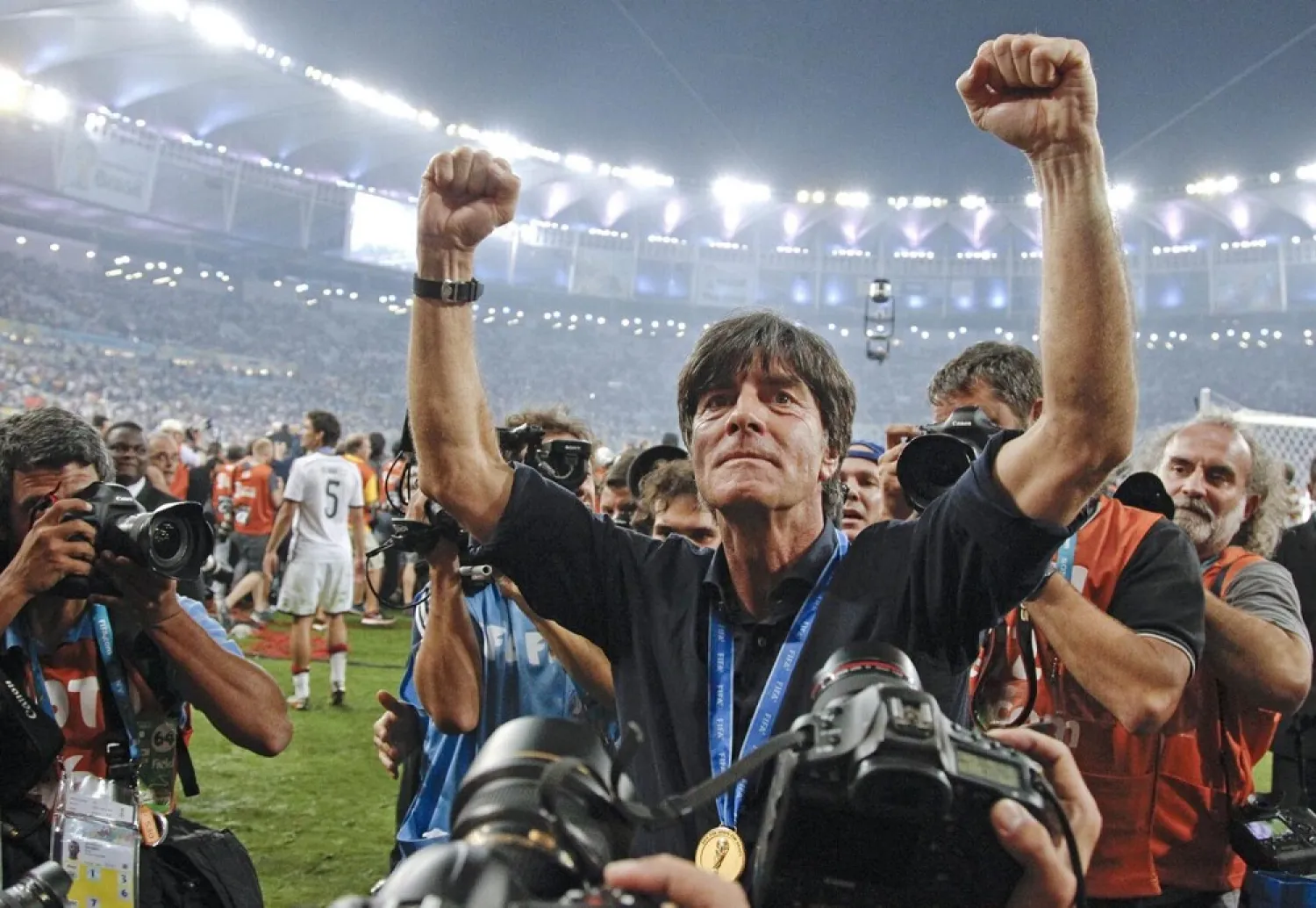 In this July 13, 2014 photo Germany's coach Joachim Löw celebrates during a victory lap after the World Cup final match between Germany and Argentina at the Maracana Stadium in Rio de Janeiro, Brazil. (AP)