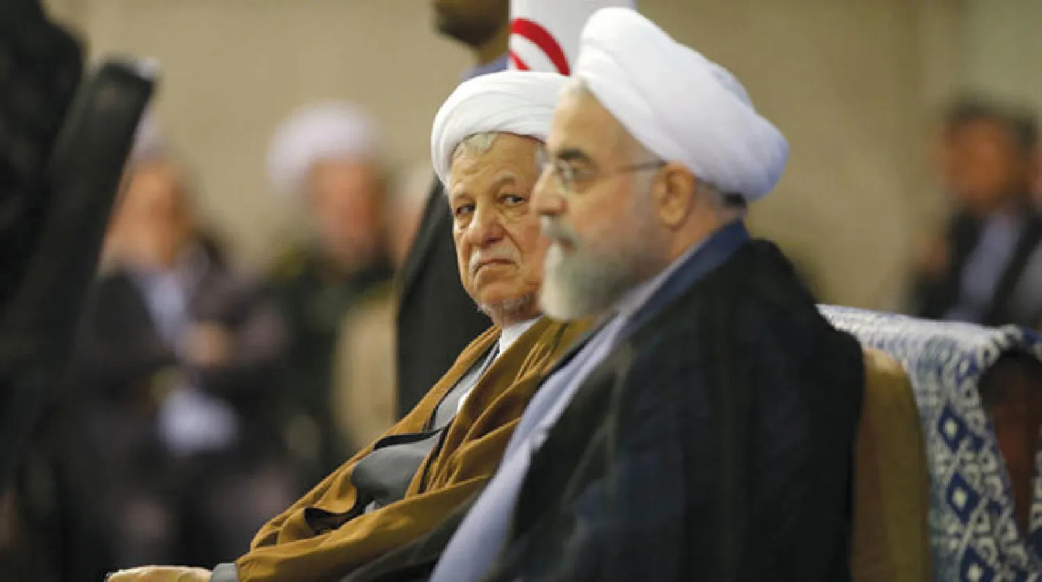 الرئيس الإيراني حسن روحاني وحليفه الرئيس الأسبق علي أكبر هاشمي رفسنجاني خلال مناسبة رسمية قبل وفاته (إيسنا)