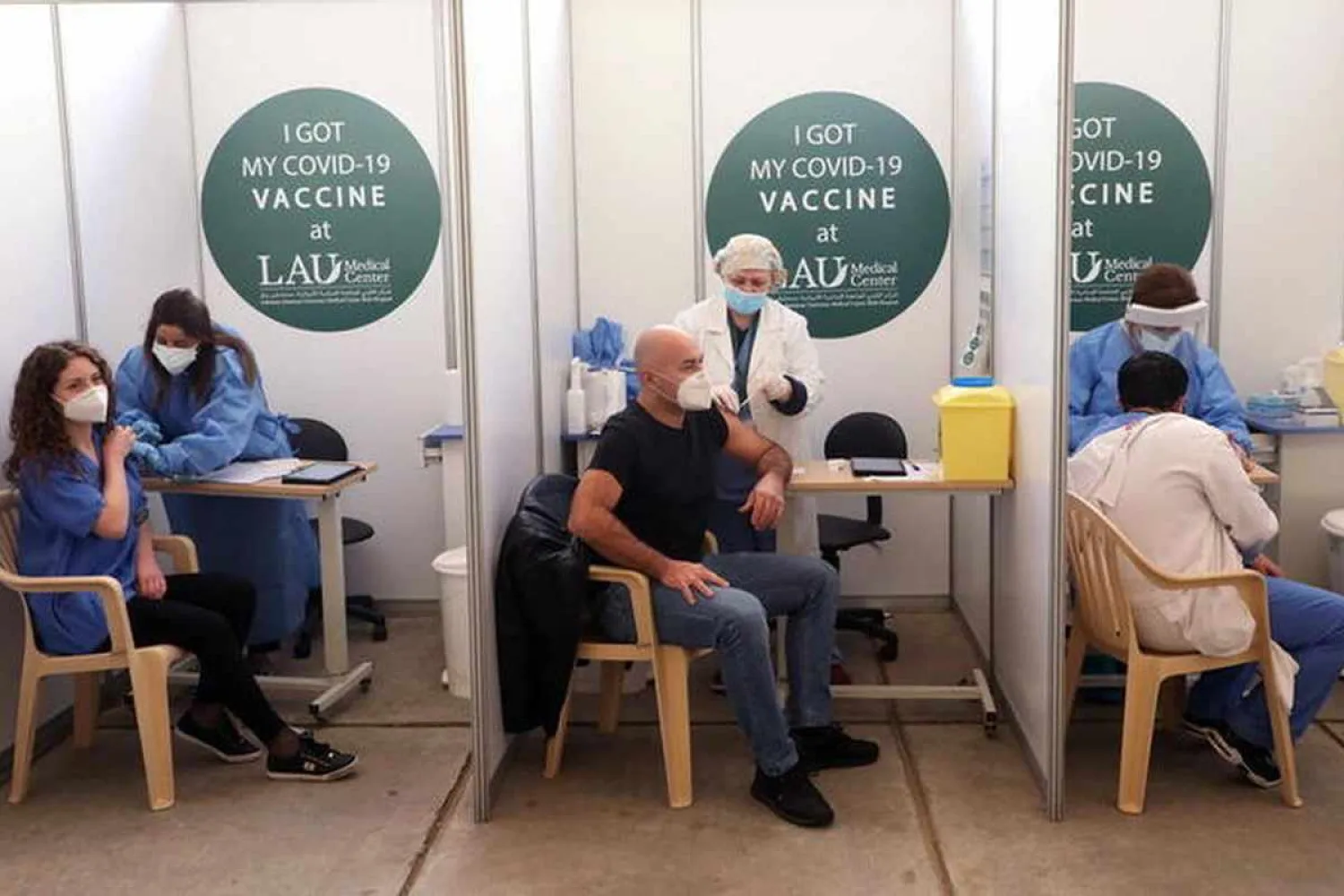 People receive a Pfizer/BioNTech COVID-19 vaccine dose during a coronavirus vaccination campaign at Lebanese American University Medical Center-Rizk Hospital in Beirut, Lebanon February 16, 2021. Reuters/Mohamed Azakir