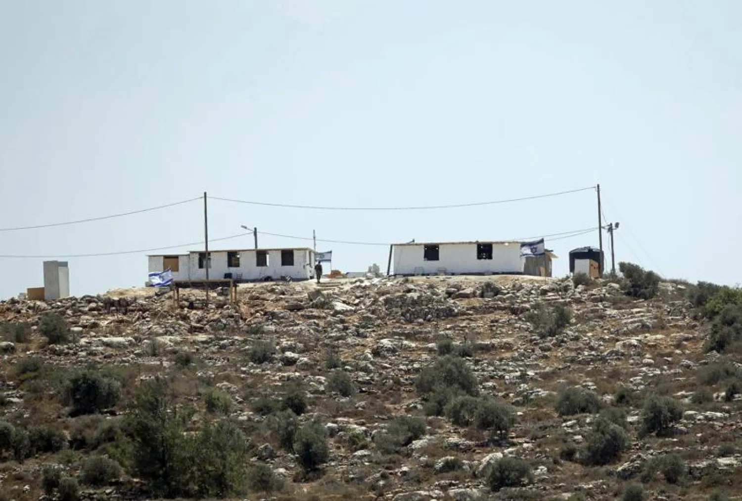 The the newly established Jewish outpost of Eviatar is seen from the Palestinian village of Beita, south of the West Bank city of Nablus, Monday, June 14, 2021.  (AP Photo/Majdi Mohammed)