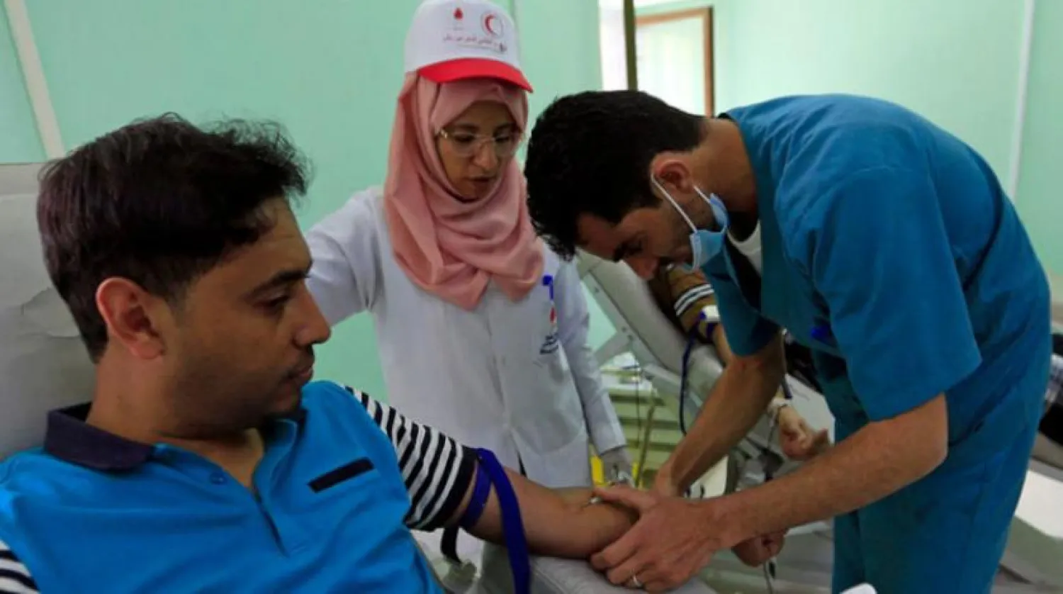 A man donates blood at a clinic in Sanaa on Monday. (AFP)