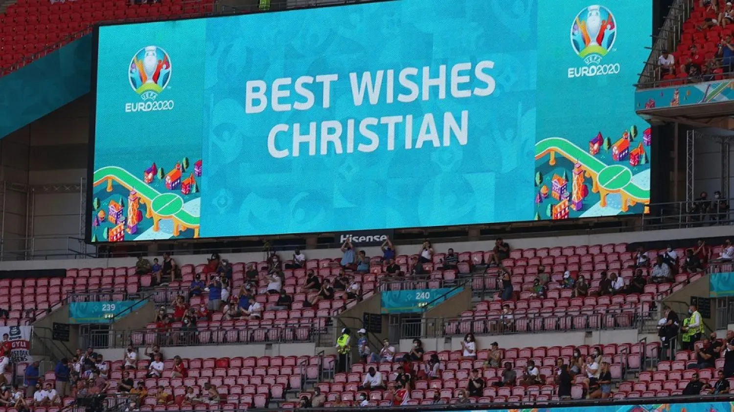 A message in support of Eriksen is displayed ahead of the Euro 2020 match between England and Croatia on Sunday. (AFP)