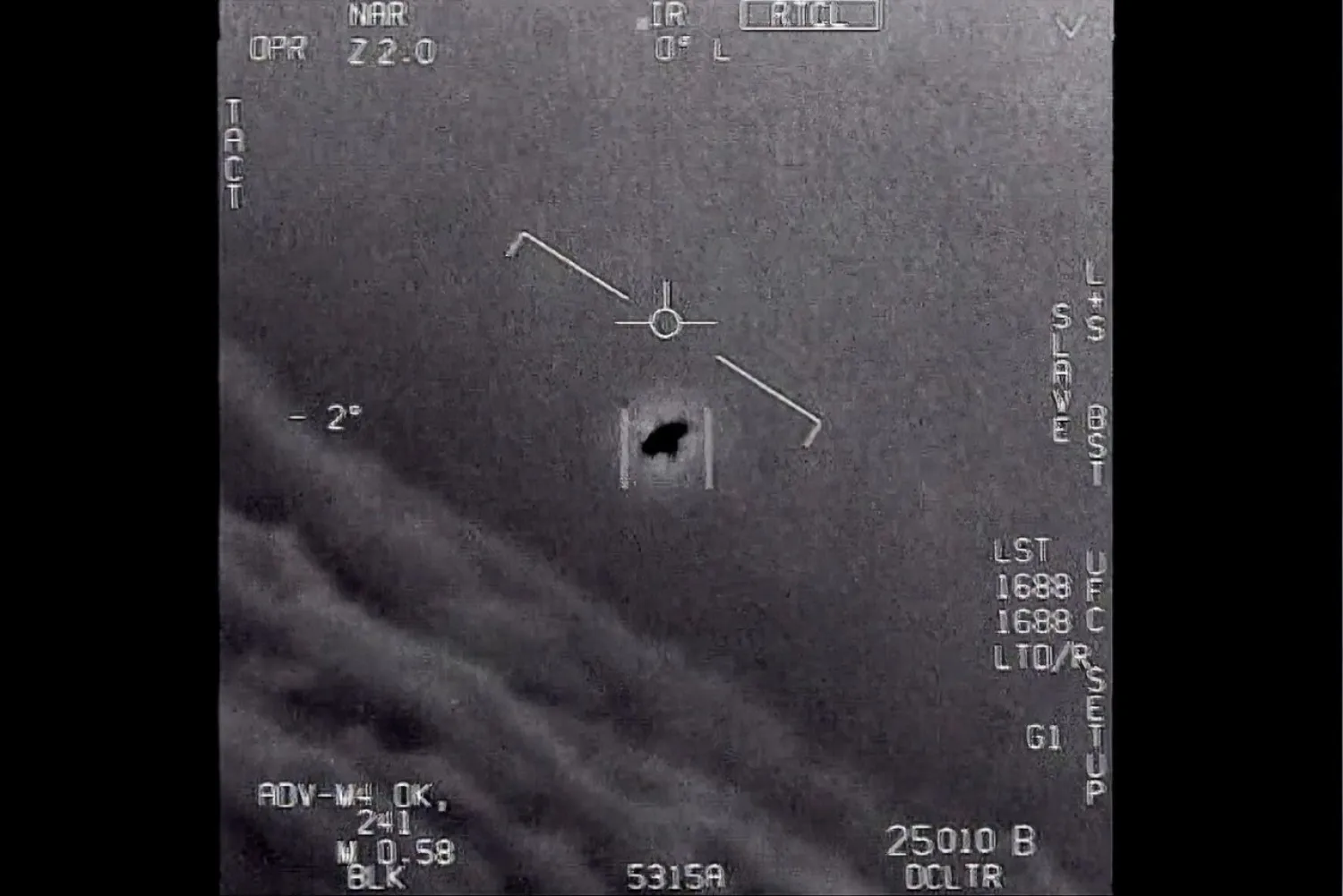 This 2015 image shows an unidentified object that rotated as it flew along clouds, according to the fighter pilots tracking it. Photo by Department of Defense via AP