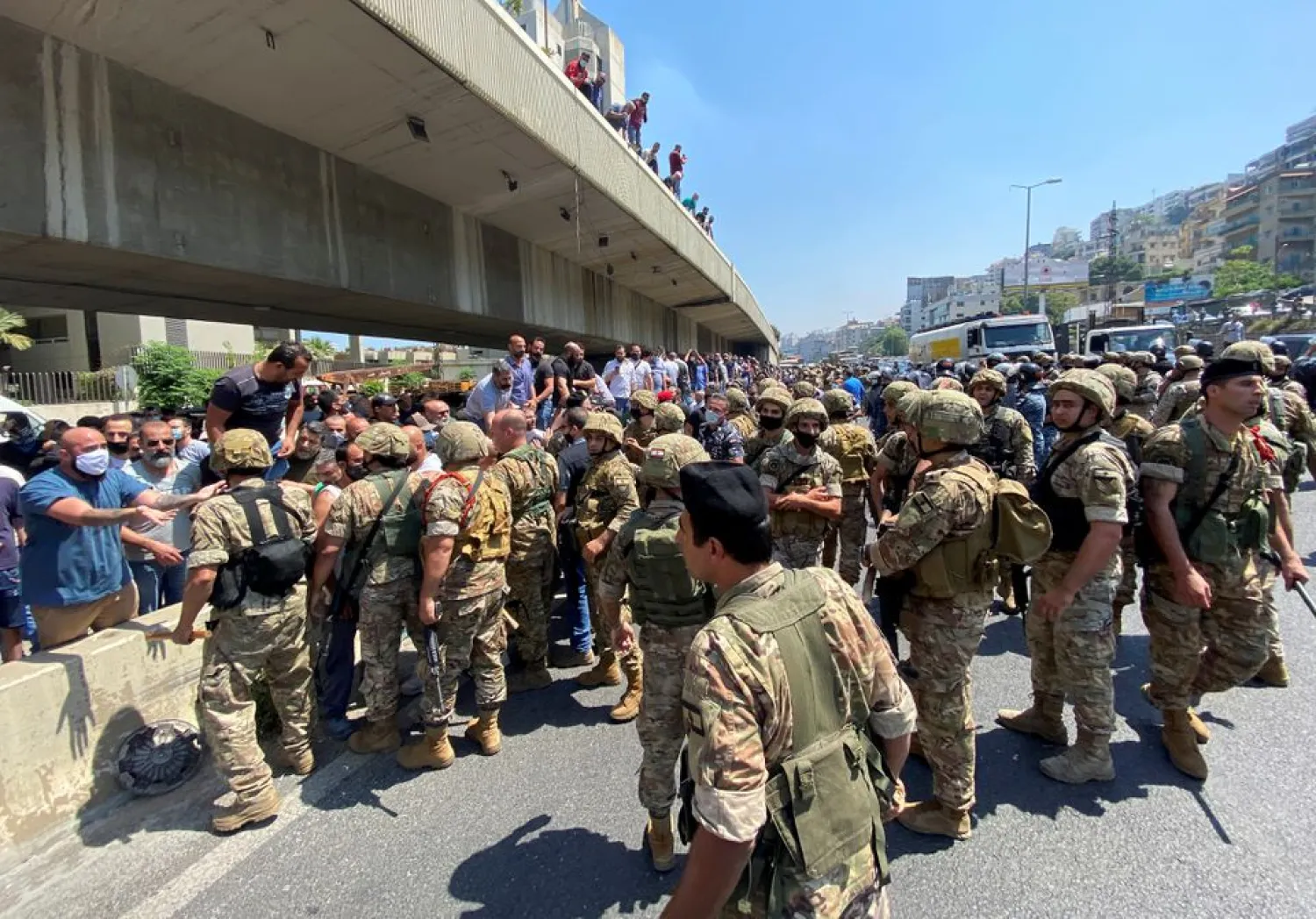 A protestor gestures as he talks with Lebanese soldiers in Nahr El Kalb, Lebanon May 20, 2021. REUTERS/Imad Creidi