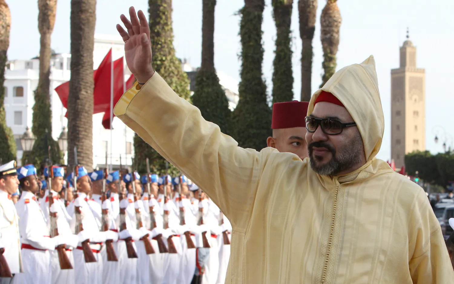 Moroccan King Mohammed VI waves to a crowd as he arrives for the opening session of the Moroccan Parliament in Rabat, Morocco, on Oct. 12, 2018. (AP Photo/Abdeljalil Bounhar)
