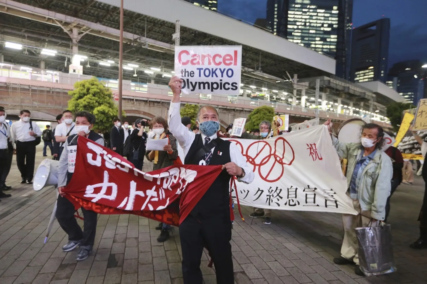 In this May 17, 2021, demonstrators protest against the Tokyo 2020 Olympics in Tokyo. (AP)