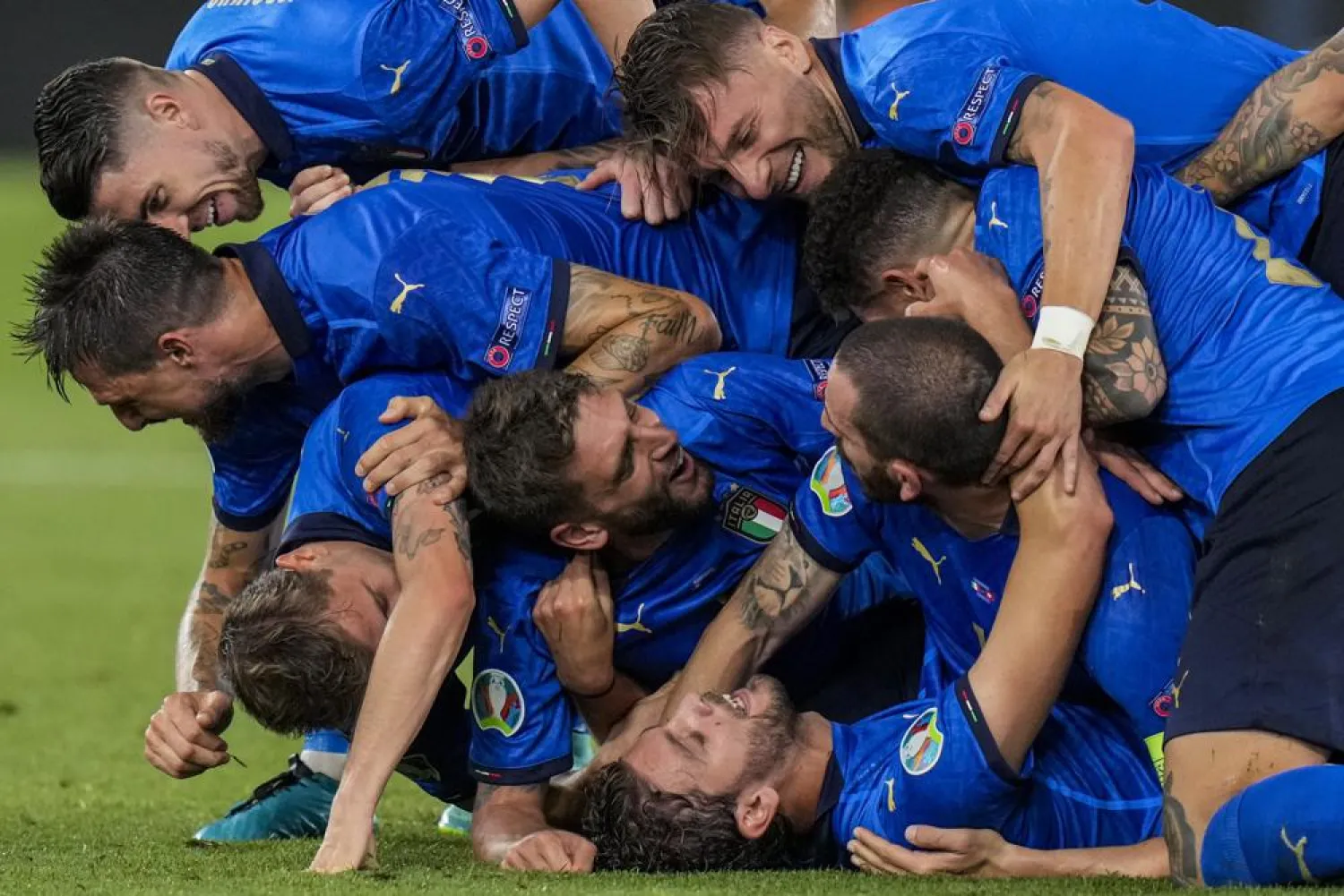 Italy players celebrate their second goal during the Euro 2020 championship group A match between Italy and Switzerland at the Olympic stadium in Rome, Italy, Wednesday, June 16, 2021. (AP)