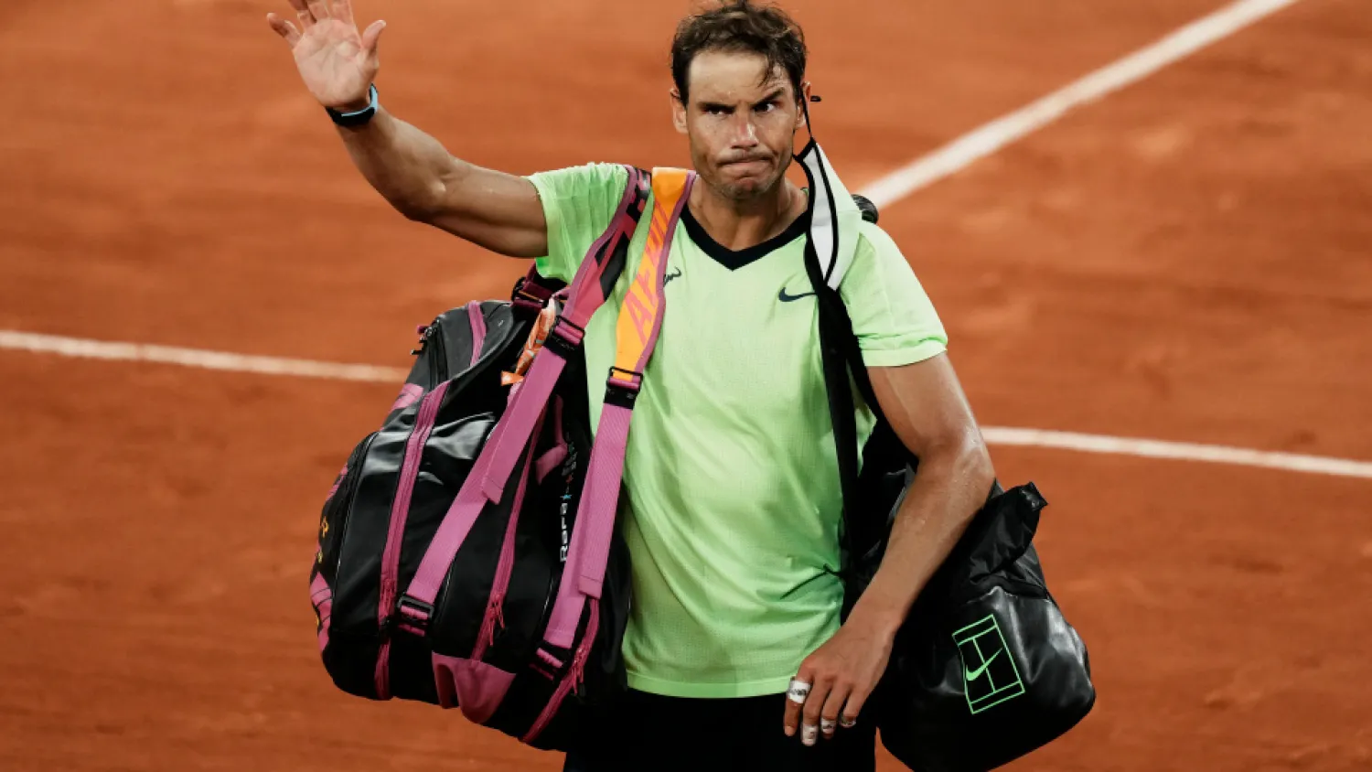 Rafael Nadal waves to the crowd after losing to Novak Djokovic in their semifinal match of the French Open tennis tournament at the Roland Garros stadium, June 11, 2021 in Paris. (AP)