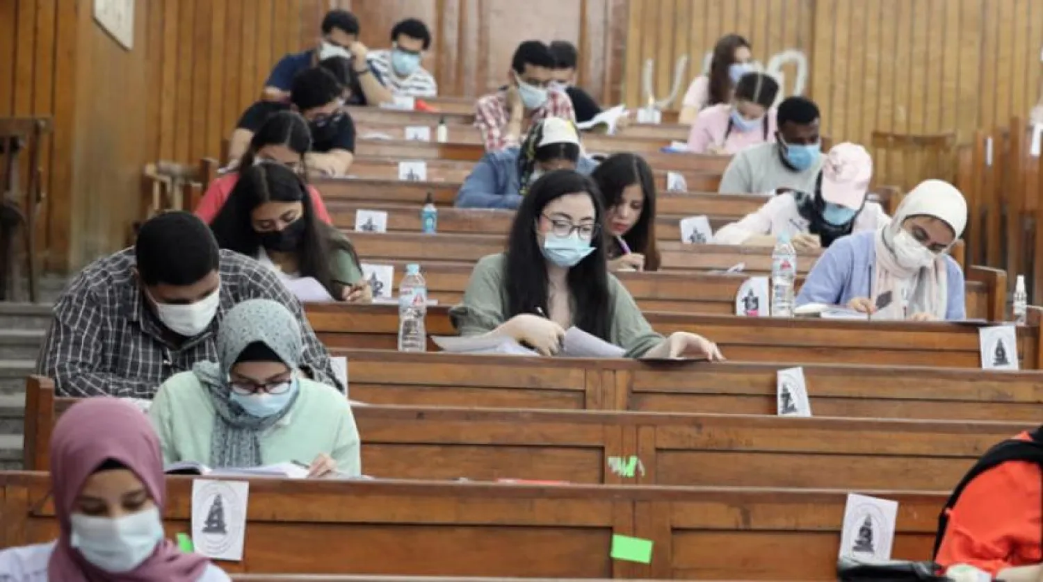 Students abiding by the precautionary measures against the coronavirus while taking exams in Giza. (EPA)