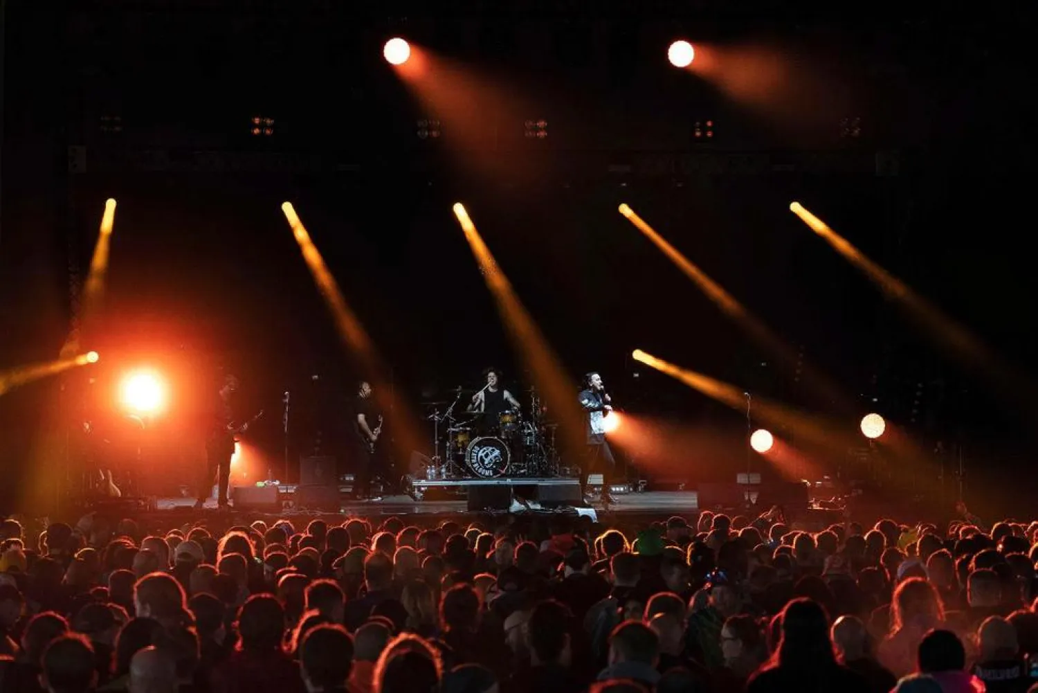 Festivalgoers watch Death Blooms rock band on stage on the first day of Download Festival at Donington Park at Castle Donington, England, Friday June 18, 2021. (AP)
