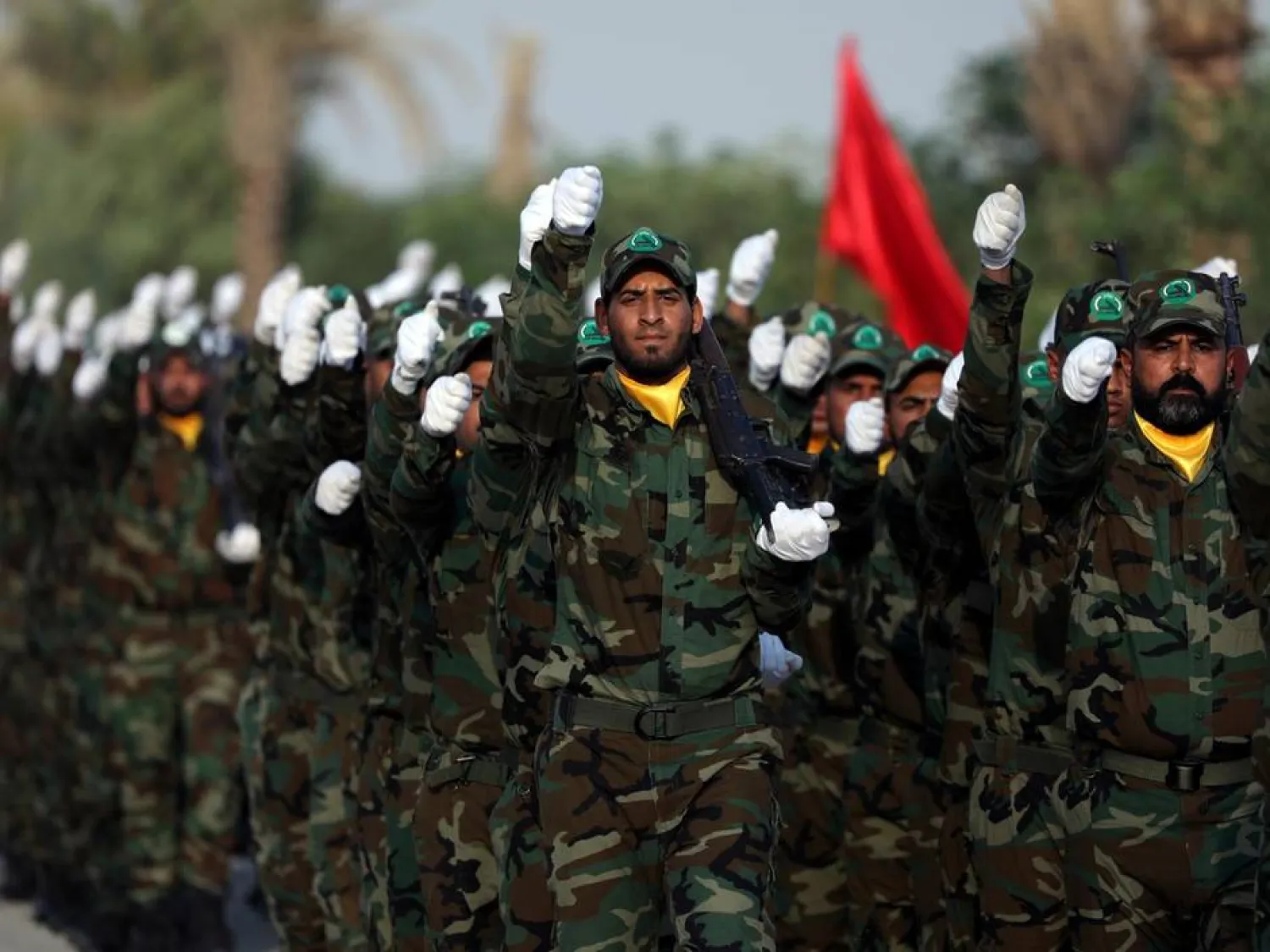 Members of the paramilitary PMF take part in their graduation ceremony at a military camp in Karbala in April. (Reuters)