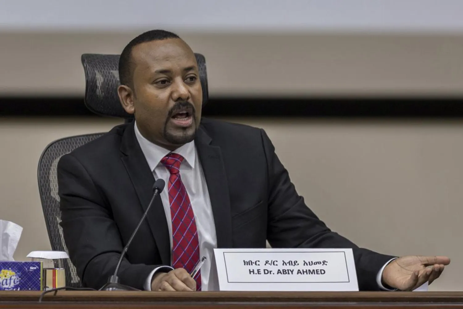 FILE - In this Monday, Nov. 30, 2020 file photo, Ethiopia's Prime Minister Abiy Ahmed responds to questions from members of parliament at the prime minister's office in the capital Addis Ababa, Ethiopia. (AP Photo/Mulugeta Ayene, File)
