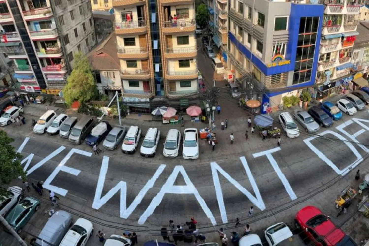 A slogan is written on a street as a protest after the coup in Yangon, Myanmar February 21, 2021. (Reuters)