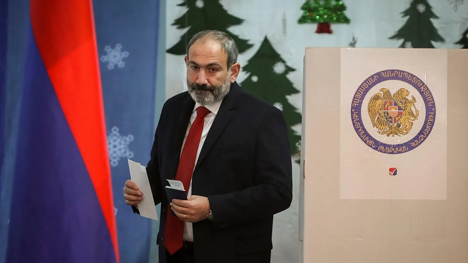 Acting Prime Minister Nikol Pashinyan votes during Armenia's snap election on Sunday. (Reuters)