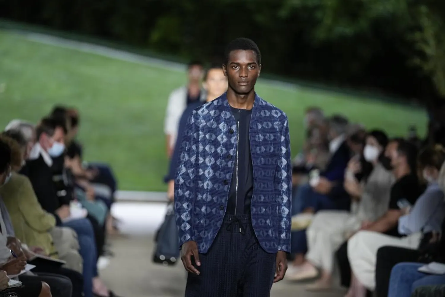 A model wears a creation as part of the Giorgio Armani men's Spring Summer 2022 collection, in Milan, Italy, Monday, June 21, 2021. (AP)