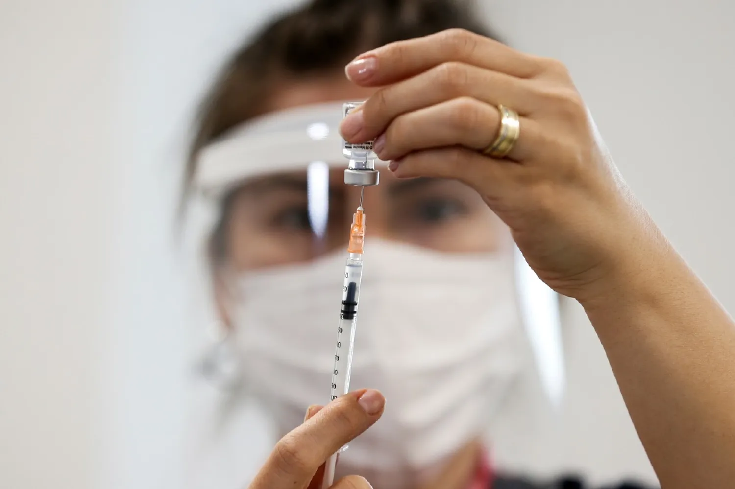 A nurse prepares a dose of the Pfizer-BioNTech coronavirus disease (COVID-19) vaccine at Ankara City Hospital in Ankara, Turkey, April 2, 2021. (Reuters)