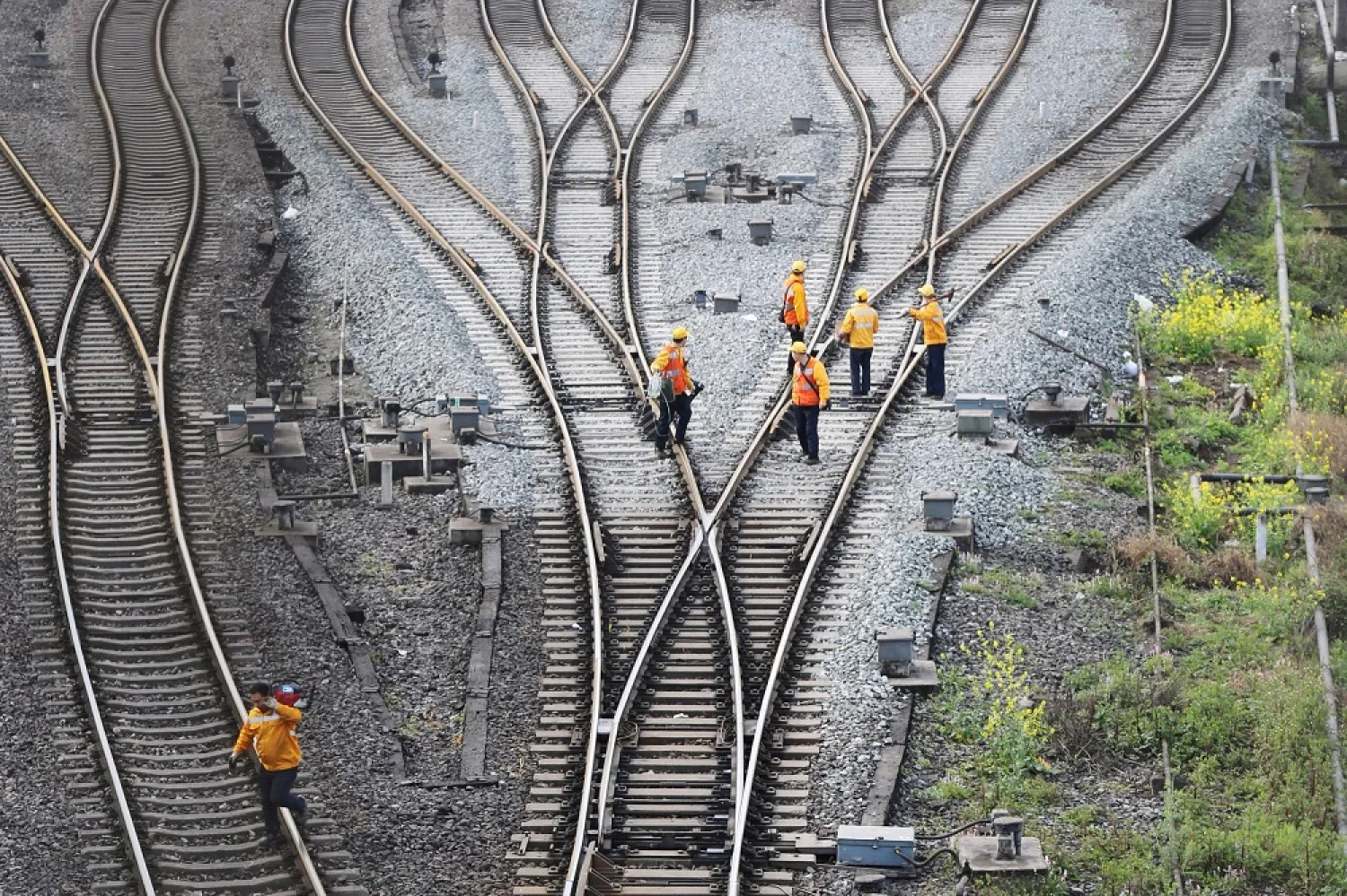 Workers inspect railway tracks that are a part of the Belt and Road freight rail route linking Chongqing, China, to Duisburg, Germany, at the Dazhou railway station in Sichuan, China. (Reuters file photo)