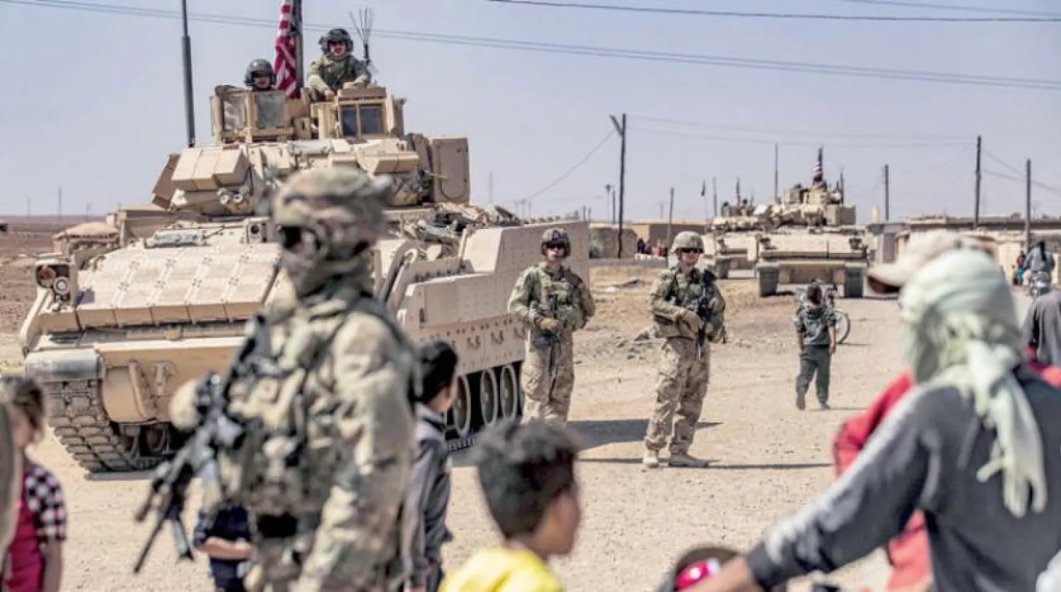 Dün Suriye'nin kuzeydoğusundaki Rumeylan'da görüntülenen ABD askerleri (AFP)