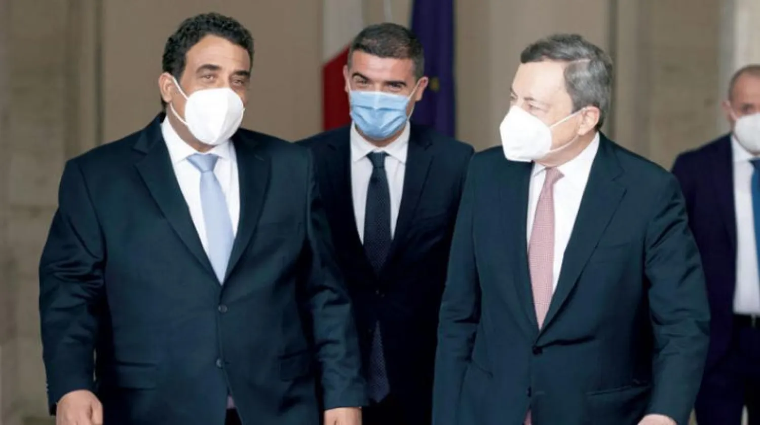 The Italian Prime Minister Mario Draghi with at the Presidential chairman of the Libyan Presidential Council, Mohamed Menfi in Rome (dpa)
