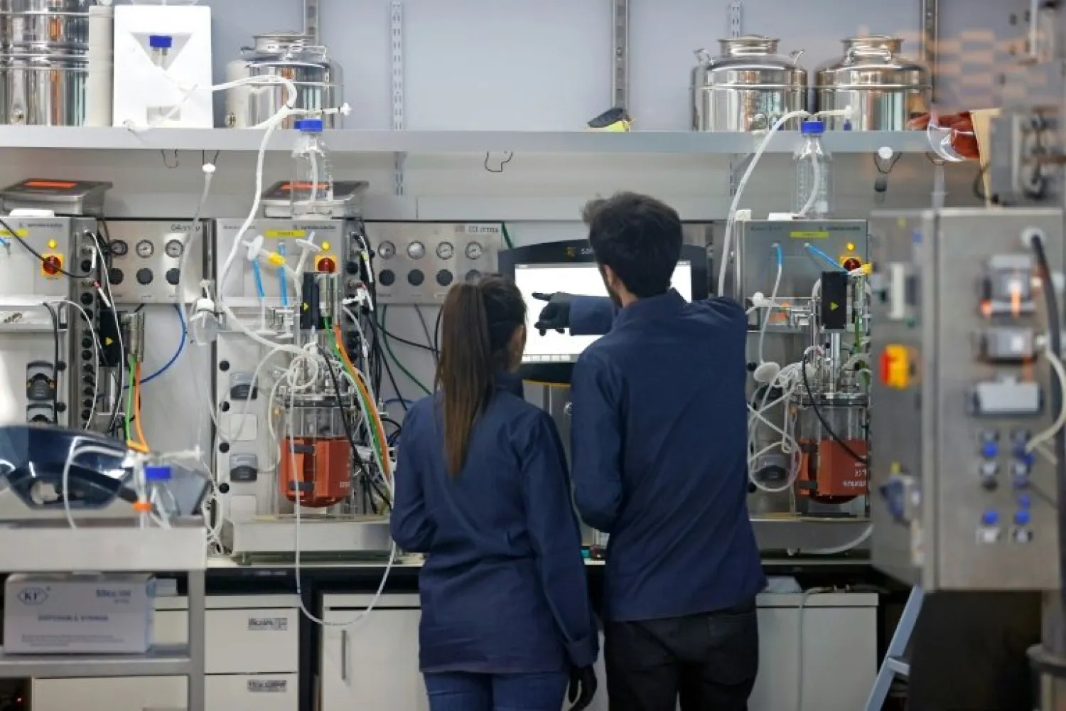 Technicians produce 'cultured chicken' meat at the food-tech startup SuperMeat - AFP