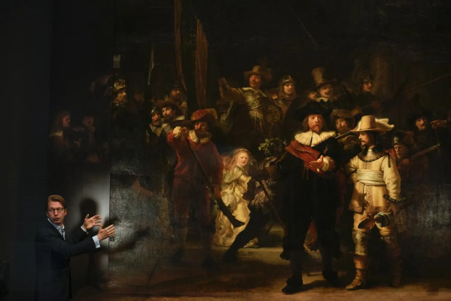 Museum director Taco Dibbits explains how Rembrandt's biggest painting the Night Watch just got bigger with the help of artificial intelligence in Amsterdam, Netherlands, June 23, 2021. (AP)