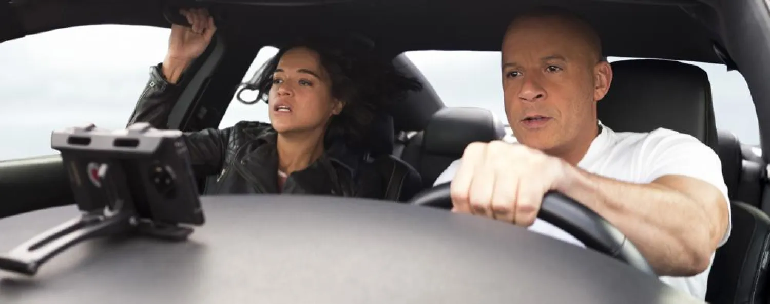 This image released by Universal Pictures shows Michelle Rodriguez, left, and Vin Diesel in a scene from F9 The Fast Saga. (Universal Pictures via AP)