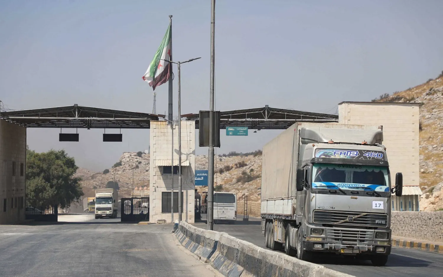 International humanitarian aid trucks cross into Syria’s northwestern Idlib province through the Bab al-Hawa border crossing with Turkey, Sept. 7, 2020. (Getty Images)