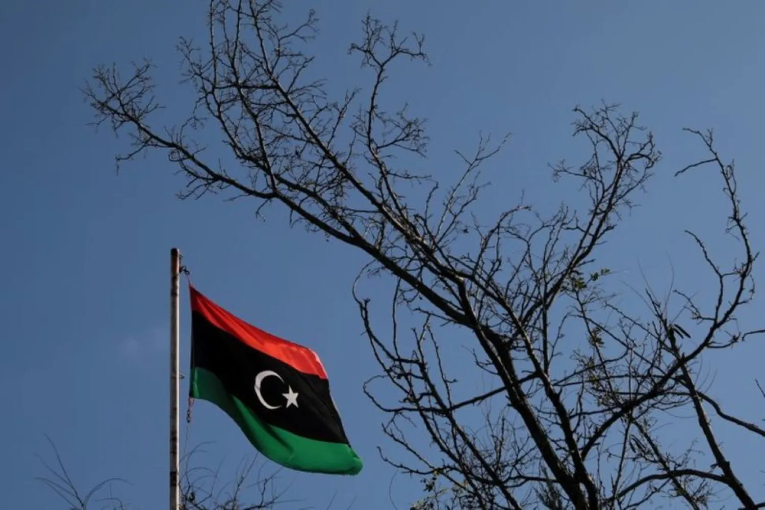 A Libyan flag flutters atop the Libyan Consulate in Athens, Greece, December 6, 2019. (Reuters)