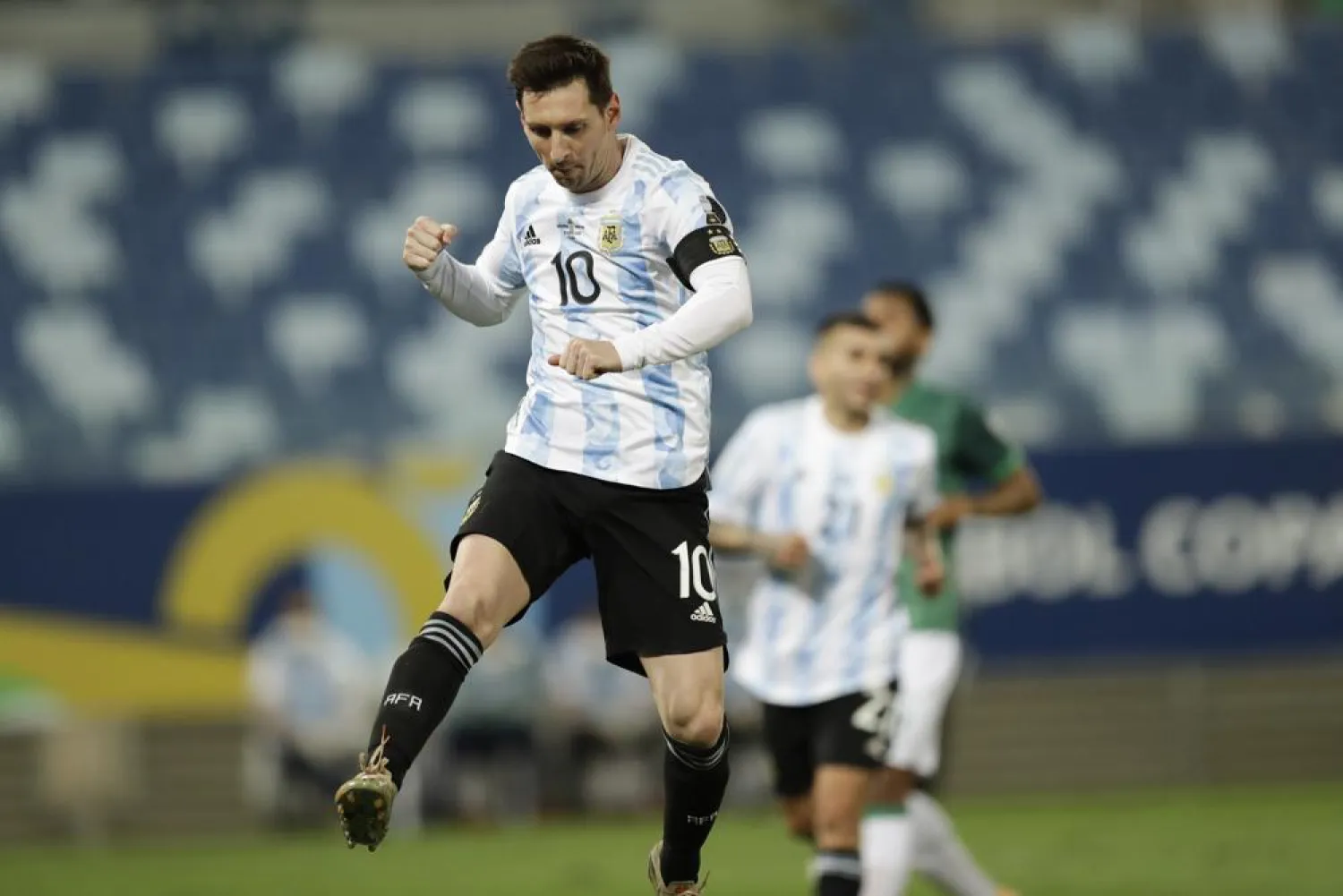 Argentina’s Lionel Messi celebrates scoring his side’s second goal from the penalty spot during a Copa America match against Bolivia at Arena Pantanal stadium in Cuiaba, Brazil, June 28, 2021. (AP)