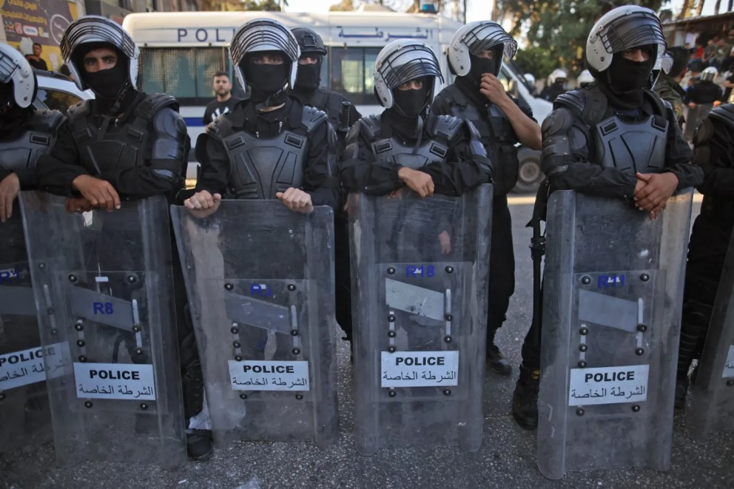  Palestinian security forces block a road during a demonstration in the city of Ramallah in the West Bank, on June 26, 2021, protesting the death of human rights activist Nizar Banat while in the custody of Palestinian Authority (PA) security forces. (AHMAD GHARABLI / AFP)
