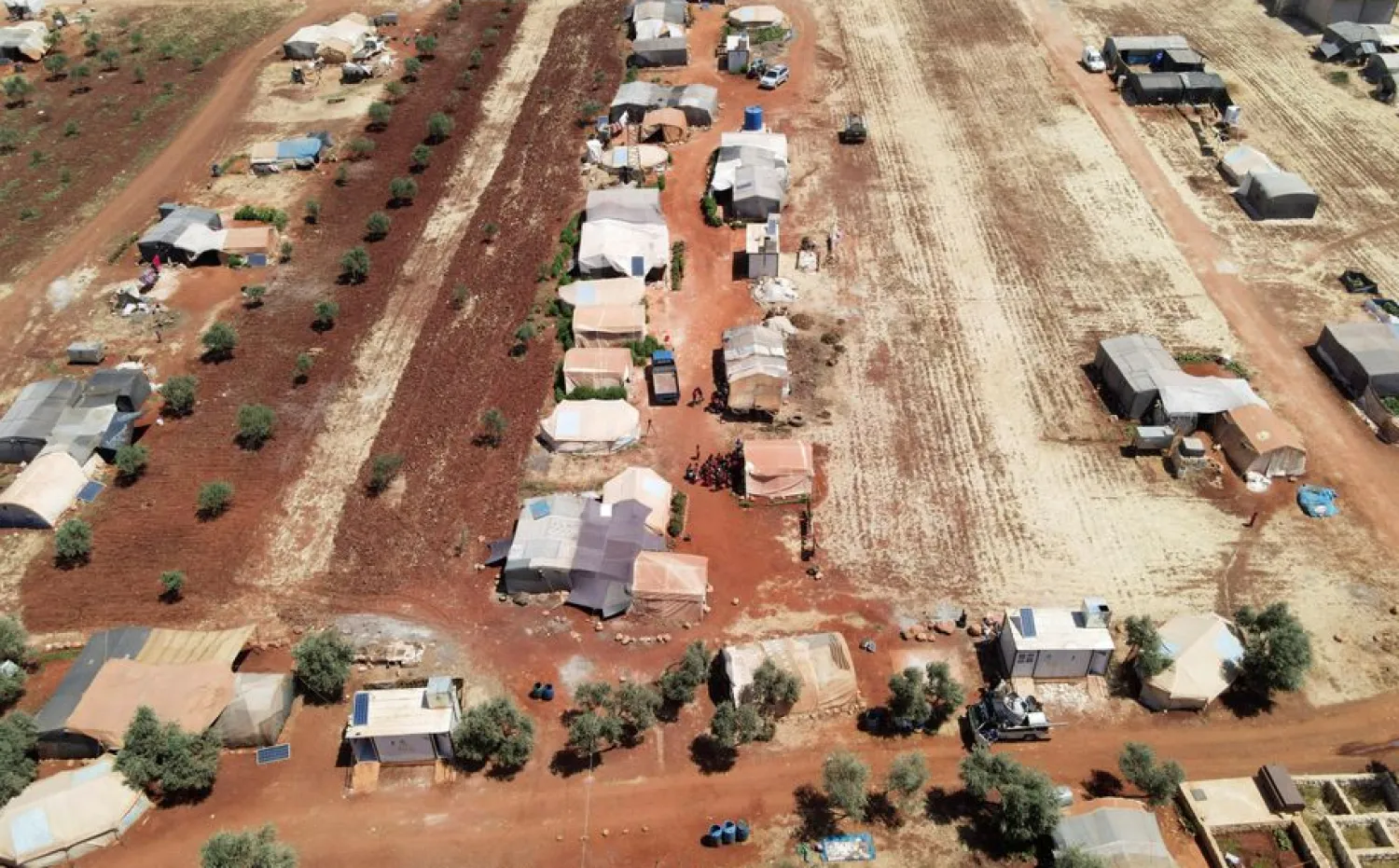 An aerial view shows tents at a camp for internally displaced people in northern Idlib, Syria, June 10, 2021. Picture taken with a drone June 10, 2021. REUTERS/Khalil Ashawi

