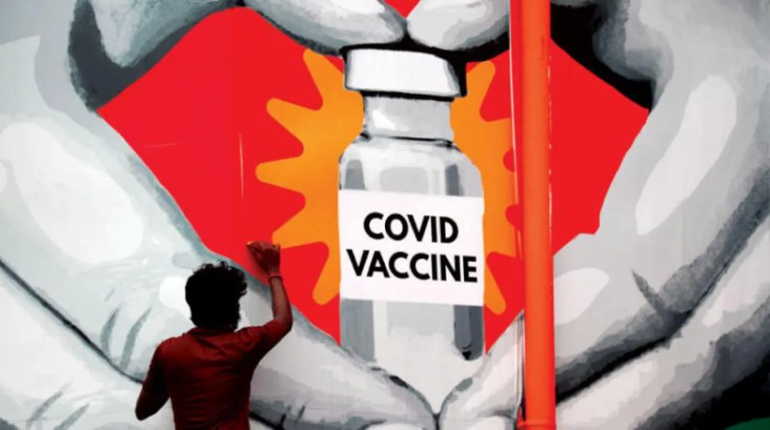 Delta varyantının ortaya çıktığı Hindistan’da aşılamanın önemine ilişkin yapılan bir duvar resmi. (DPA)