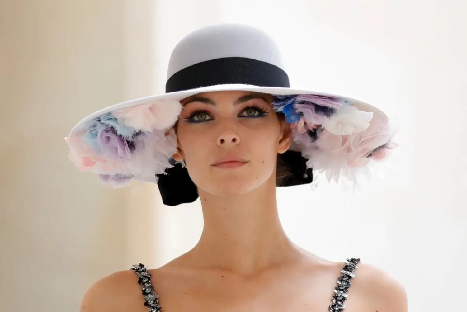 A model presents a creation by designer Virginie Viard as part of her Haute Couture Fall/Winter 2021-2022 collection show for fashion house Chanel in Paris, France, July 6, 2021. (Reuters)