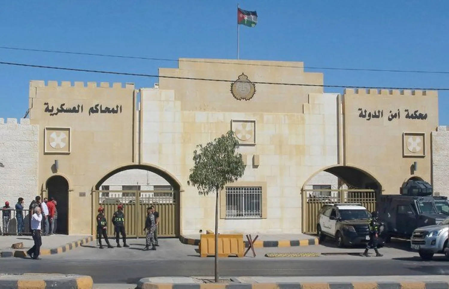 Police officers stand guard outside the State Security Court in the Jordanian capital Amman. (File/AFP)
