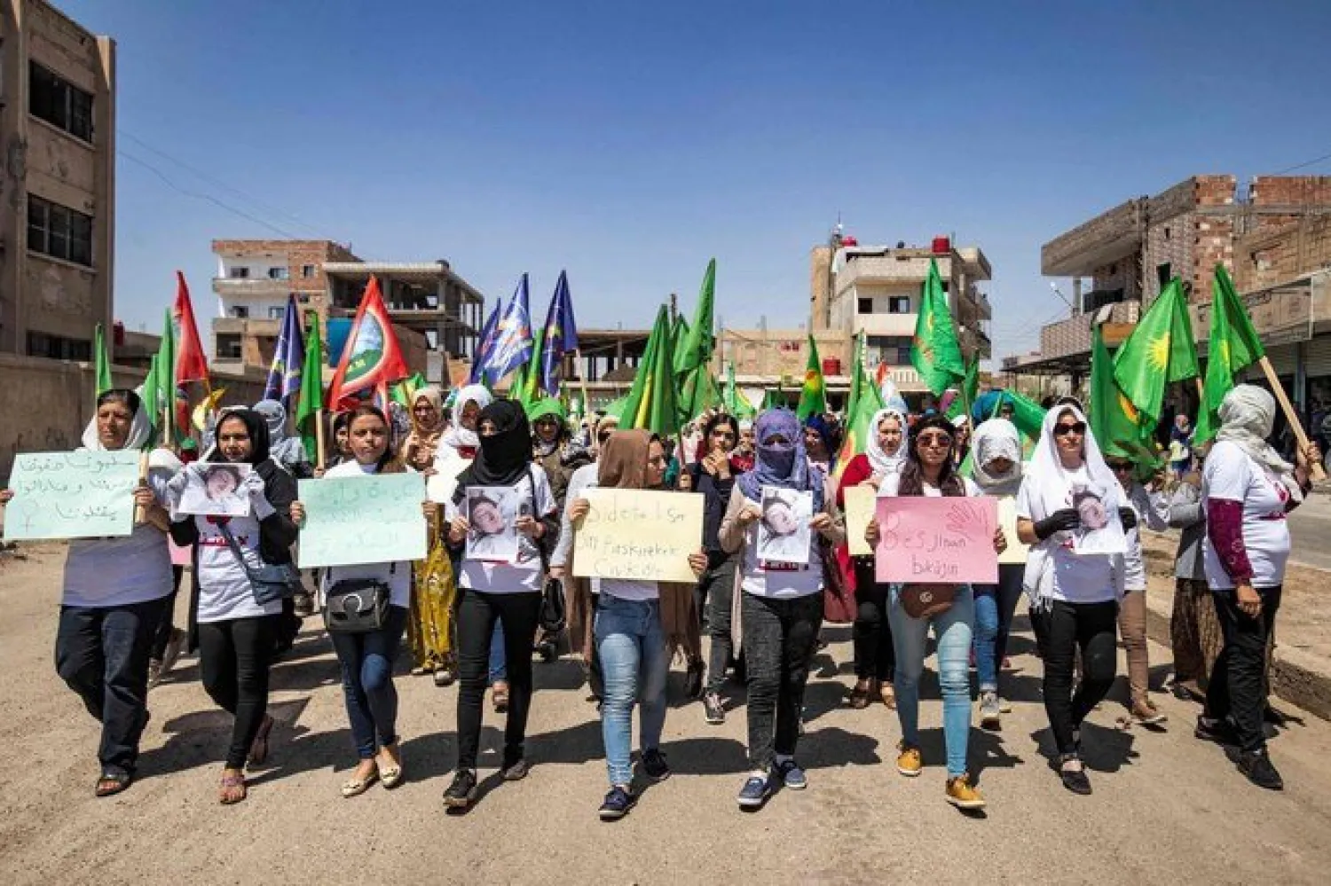 Syrian Kurdish women attend a protest against so-called “honor killings” in Syria’s northeastern city of Hasakah on Tuesday. (AFP)
