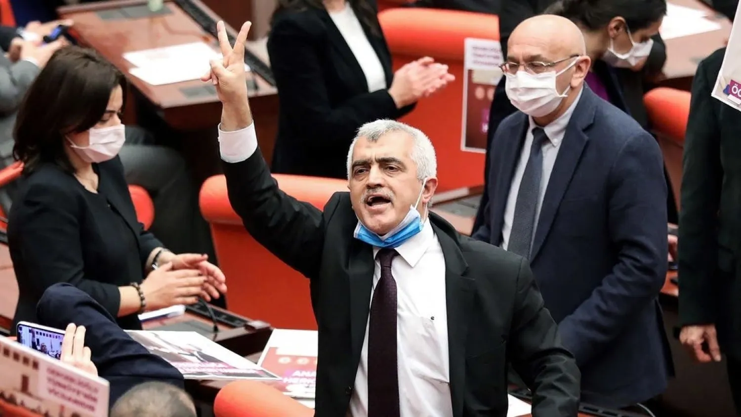 A file photo shows Omer Faruk Gergerlioglu (C) reacts after he was dismissed following a vote at the Turkish Parliament in Ankara, on March 17, 2021. (Adem Altan/AFP)
