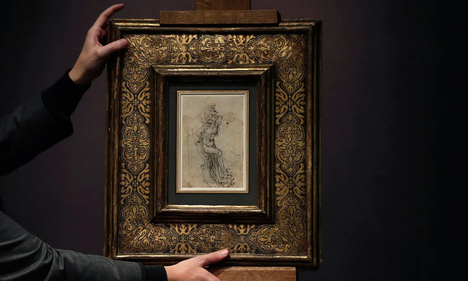 An employee of the French auction house Tajan displays ‘The Martyred Saint Sebastian’, identified as being drawn by Leonardo da Vinci during a media presentation in Paris, France, 10 January 2017. Photo by Christian Hartmann/Reuters