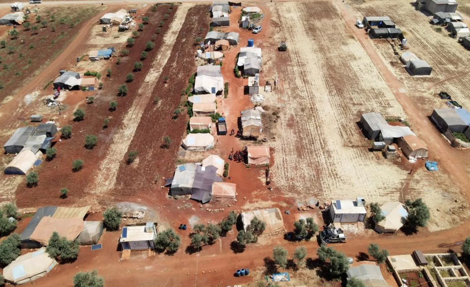 An aerial view shows tents at a camp for internally displaced people in northern Idlib, Syria, June 10, 2021. Picture taken with a drone June 10, 2021. REUTERS/Khalil Ashawi

