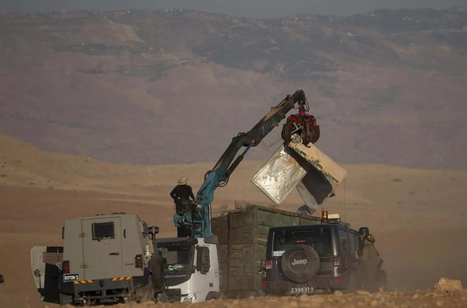 Israeli forces demolish tents and other structures belong to Bedouins at the Khirbet Humsu hamlet in Jordan Valley in the West Bank, Wednesday, July 7, 2021. (AP Photo/Majdi Mohammed)
