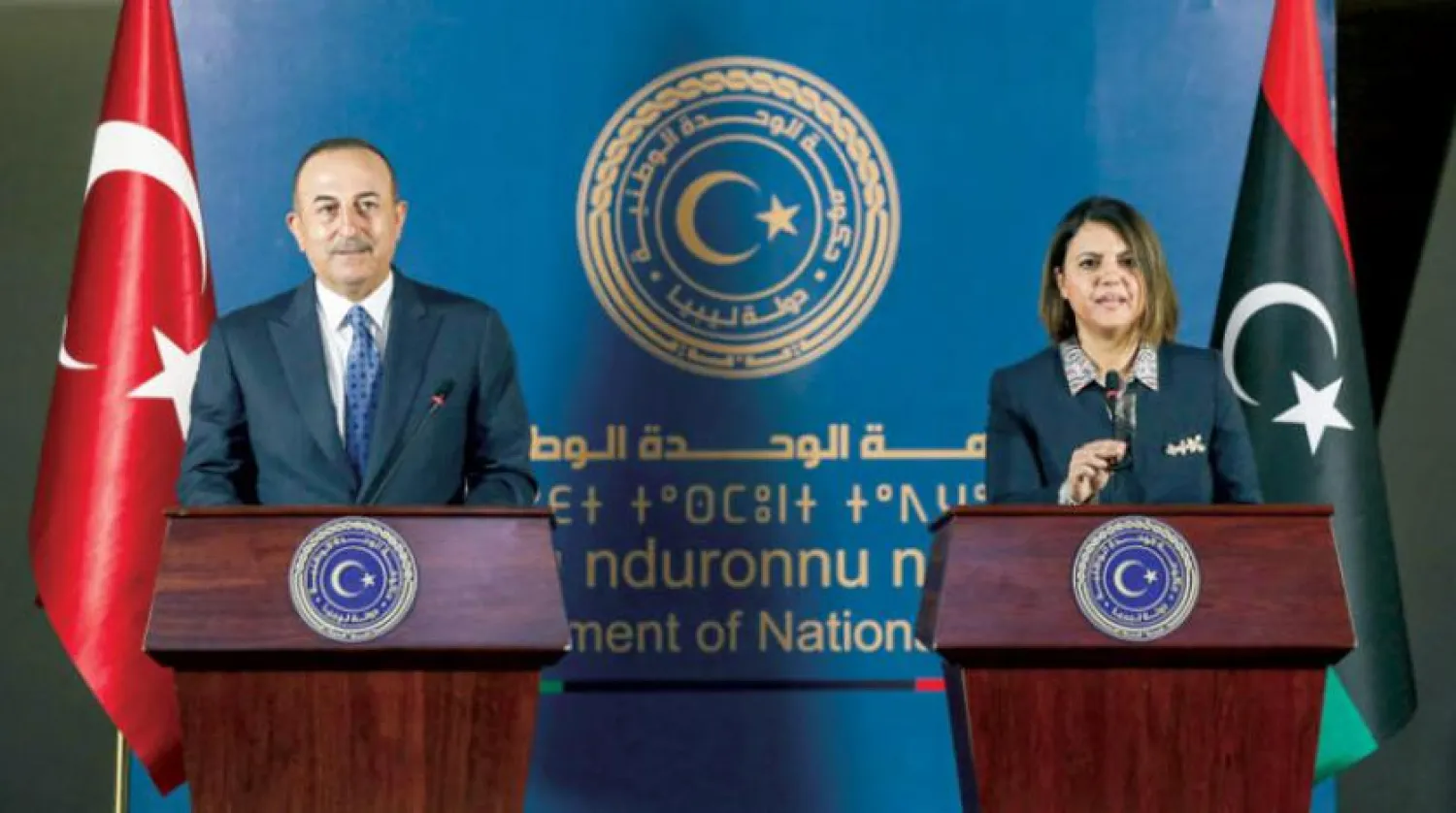 Turkish Foreign Minister Mevlut Cavusoglu with his Libyan counterpart Najla al-Manqush in Tripoli last May. (AFP)
