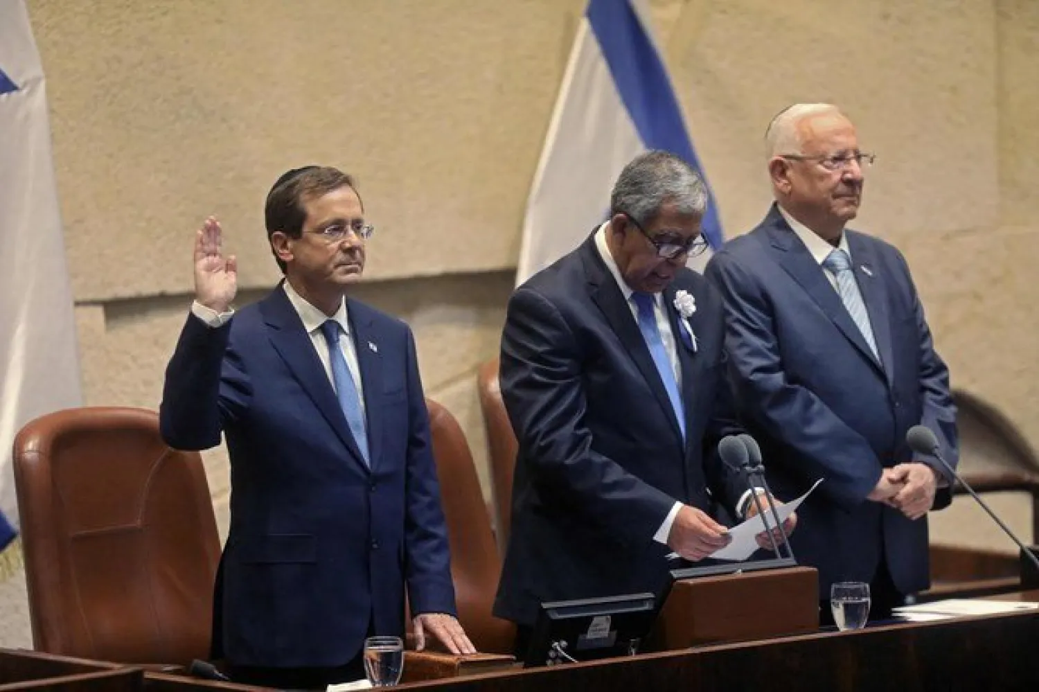 Isaac Herzog, left, a Labor Party veteran, is sworn in, before parliament, as Israel’s 11th president, replacing Reuvin Rivlin, right, at the Knesset, in Jerusalem, on July 7, 2020. (AFP)
