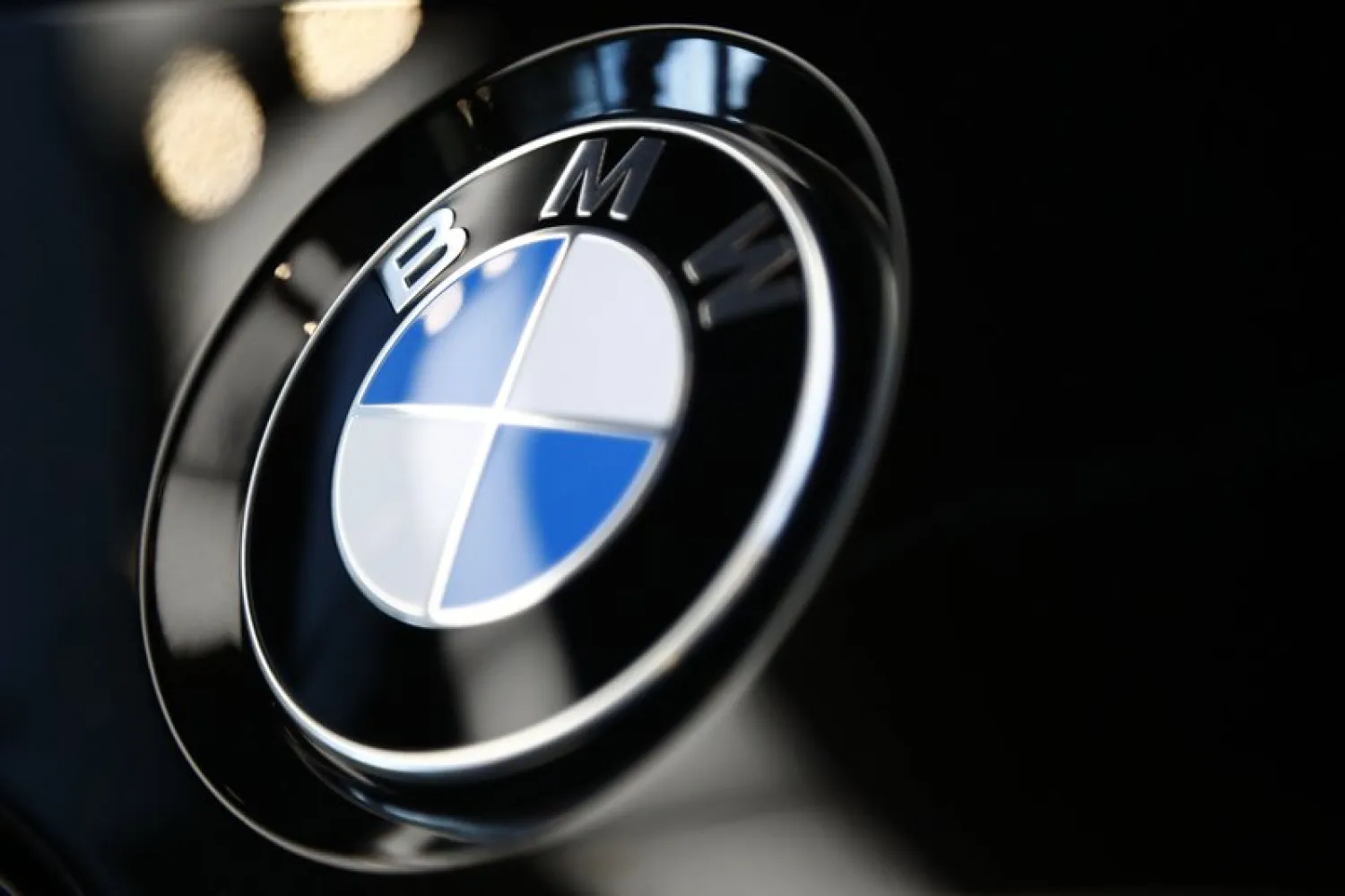 File---Picture taken on March 20, 2019 shows the logo of German car manufacturer BMW is pictured on a BMW car prior to the earnings press conference in Munich, Germany. (AP Photo/Matthias Schrader)
